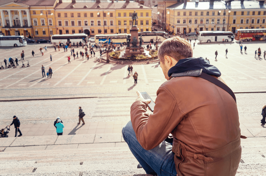 traveler using phone with esim in Helsiki - Finland